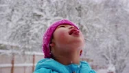 Girl Catching Snow Flakes On Tongue Stock Footage