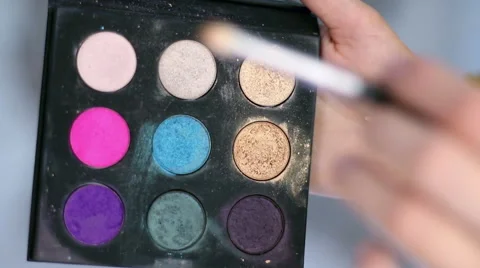 Girl causes a shadow to make up on brush Stock Footage 65453033