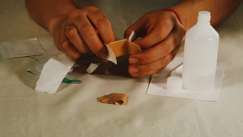 The girl changes the patch on her finger, close-up Stock Footage 108054750