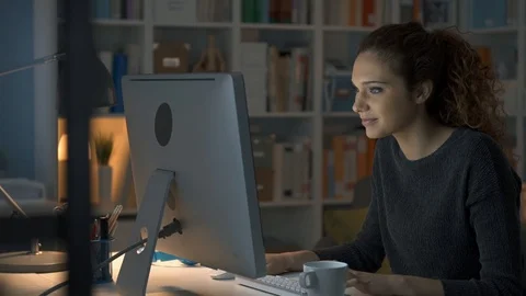 Girl chatting at night with her computer Stock Footage 89647607