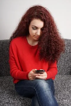 Girl checking her smartphone Stock Photos