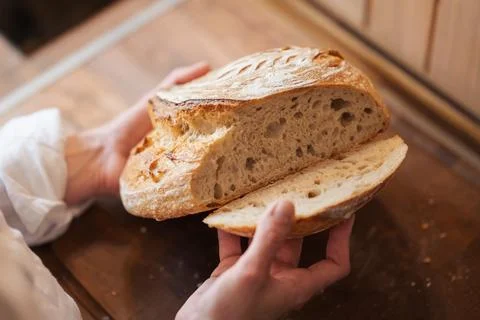 Girl checking quality of self made palianytsia bread Stock Photos