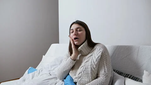 Girl checking temperature with a thermometer. Common cold, disease. Concept of Stock Footage 125829205