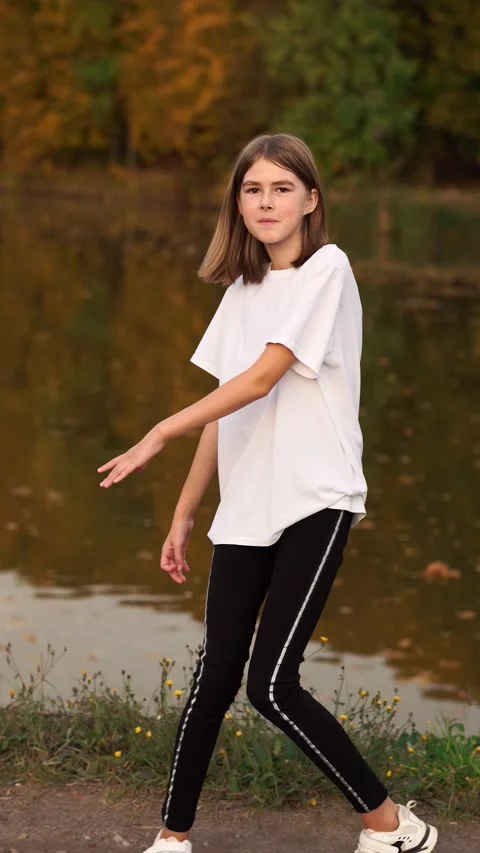The girl cheerfully poses for the camera. Stock Footage 260475587