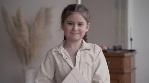 Girl child blogger with a mobile gadget broadcasts in zoom. Fooling around on Stock Footage