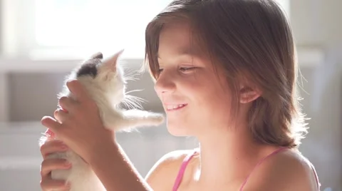 Girl child with kitten slow motion Stock Footage