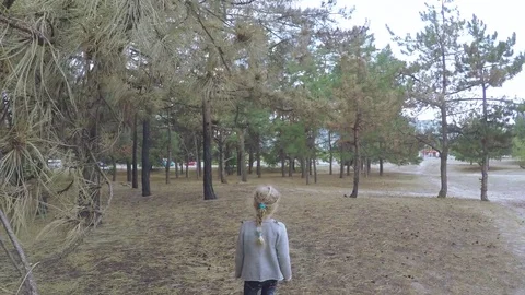Girl child runs through the forest Stock Footage
