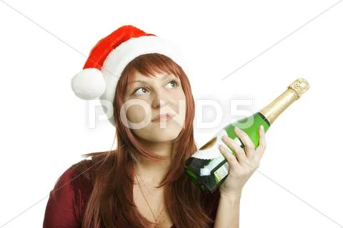 The girl in a christmas cap Stock Photos