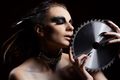 Girl with circular saw Stock Photos