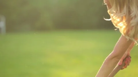 Girl cleans grass rake Video stock 82019210