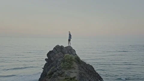 Girl on a cliff Stock Footage 228386530