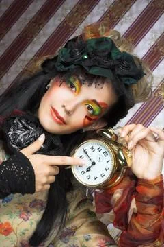 Girl with clock. Stock Photos