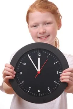 Girl with clock Stock Photos