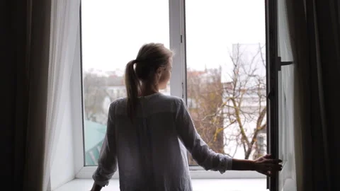 Girl closes the open window Stock-Footage 101167666