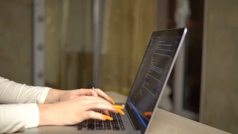 Girl coding html on laptop programming website online working freelance Stock Footage 127057412