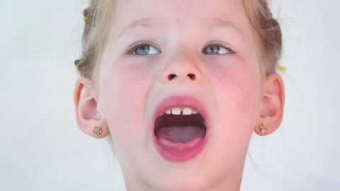 The girl collects drool on her tongue. T... | Stock Video 