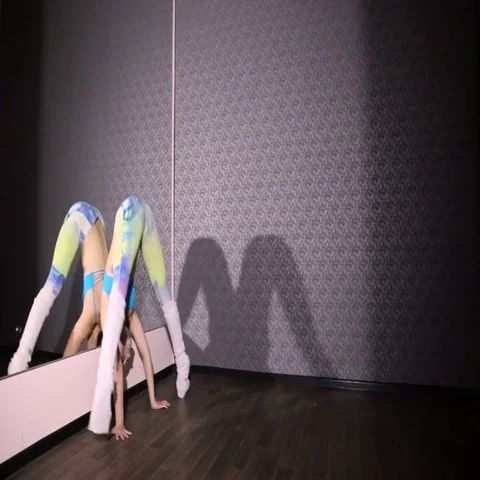 Girl in color dancing pole dance twine mirror Stock Footage 69501103