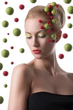 Girl with colored spheres on the face Stock Photos