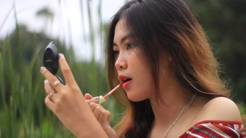 Girl Coloring Lips Stock Footage 121430591