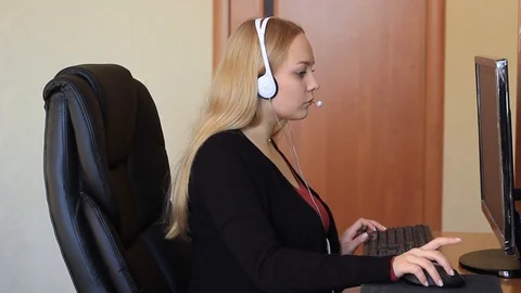Girl communicates using headset. Stock Footage 99343098