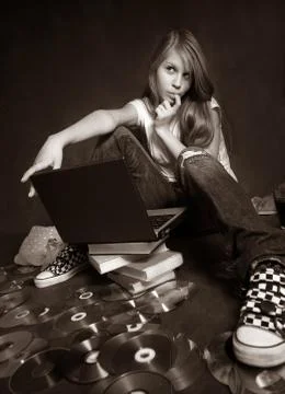 Girl with a computer Stock Photos