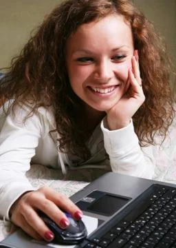 Girl with a computer Stock Photos