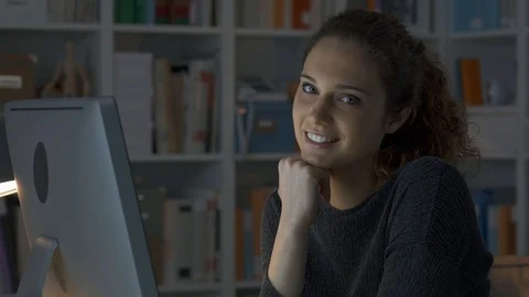 Girl connecting with her computer and smiling Stock Footage 89647903