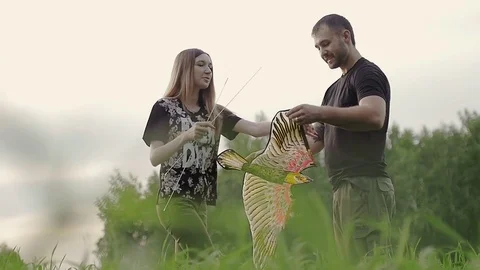 Girl constructed a kite Stock Footage 79606261
