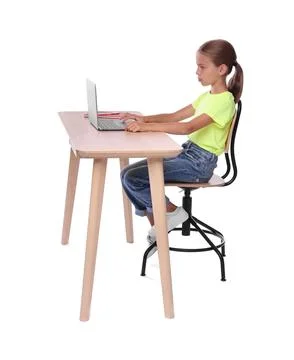 Girl with correct posture using laptop at wooden desk on white background Stock Photos