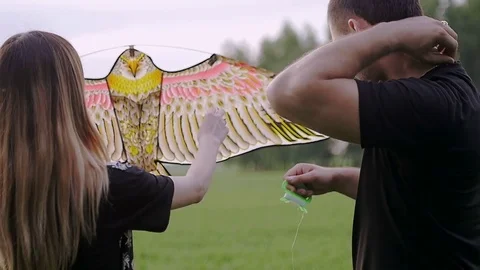 Girl corrects the a kite Video stock 79605700