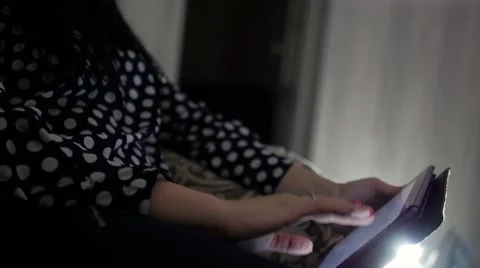Girl on the couch with a tablet in hands Stock Footage 61602855