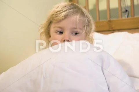 Girl Covered With Blanket On Bed, Close Up
