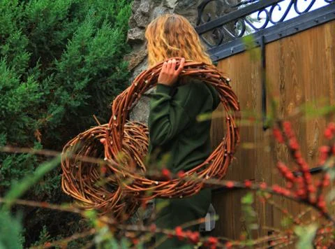 Girl with craft wreaths Stock Photos