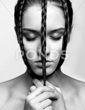 Girl with creative hair-do Stock Photos