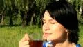 Girl with cup of tee HD Footage