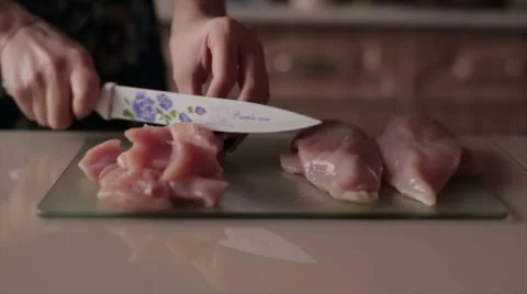 Girl cuts chicken fillets Stock Footage 59113170