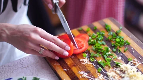Girl cuts vegetables Video stock 89936581