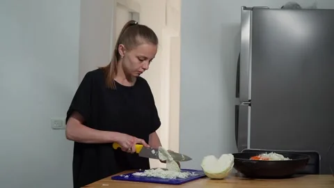 Girl cutting cabbage Stock Footage 244481003
