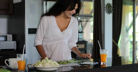 Girl Cutting Vegetables Using Tablet Computer Internet Online, Young Woman Happy Stock Footage 75211023