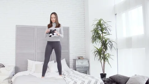 Girl dance bed Stock Footage 88155970
