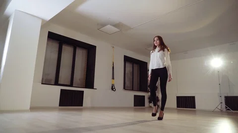 The girl in the dance studio dances in front of the mirror. Stock Footage 86810958