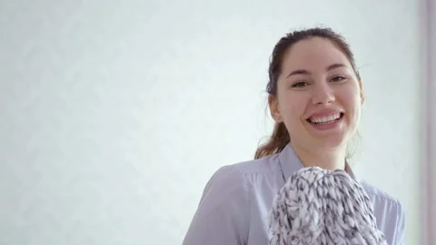 A girl dances with a MOP while cleaning. Good mood Stock Footage 140642576