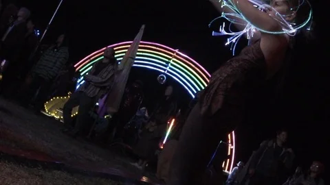 Girl dancing and performing with neon lights at music festival Stock Footage 122380945