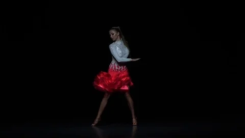 Girl dancing ballroom-sports dance, dark background. Slow motion Stock Footage