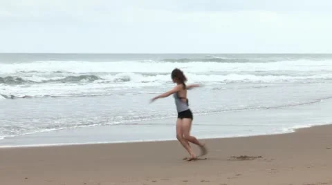 Girl Dancing on Beach Stock Footage 21223212