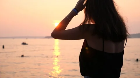 Girl dancing on the beach at sunset Stock Footage 115546698