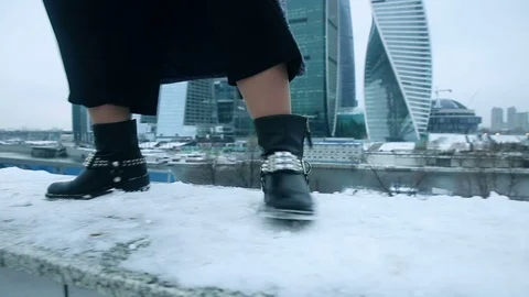 Girl dancing in boots in the snow Stock Footage 70150330