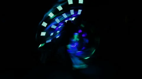 The girl is dancing a cool butterfly dance in a fluorescent suit with light Stock Footage