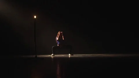 Girl dancing in the dark with a light bulb. Video stock 72305151