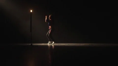 Girl dancing in the dark with a light bulb. Video stock 72305404